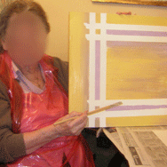 Resident showing off her painting